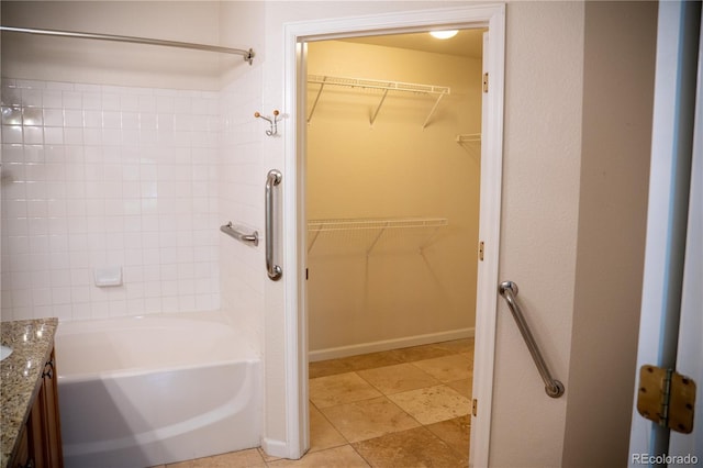 2980 W Centennial Dr Unit L, Littleton, CO 80123 - full bath featuring vanity, shower / bathtub combination, and a spacious closet