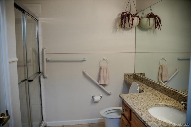 2980 W Centennial Dr Unit L, Littleton, CO 80123 - full bathroom featuring a shower stall, vanity, toilet, tile patterned flooring, and baseboards