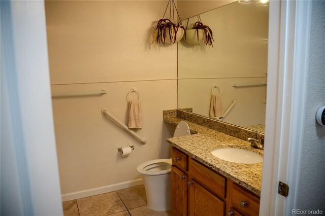 2980 W Centennial Dr Unit L, Littleton, CO 80123 - bathroom with vanity, tile patterned floors, toilet, and baseboards