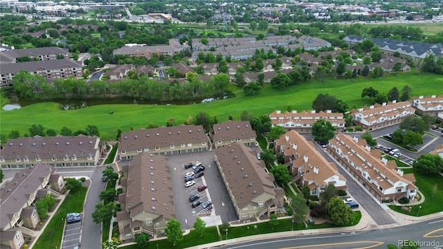 2980 W Centennial Dr Unit L, Littleton, CO 80123 - aerial view of property and surrounding area with a golf course and nearby suburban area