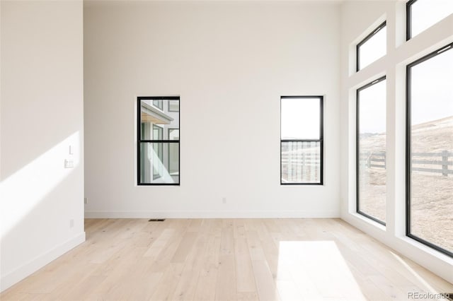 spare room with light hardwood / wood-style floors