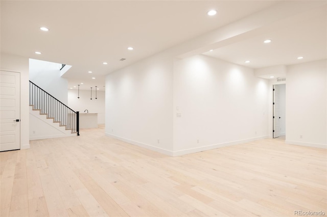 empty room with light hardwood / wood-style floors