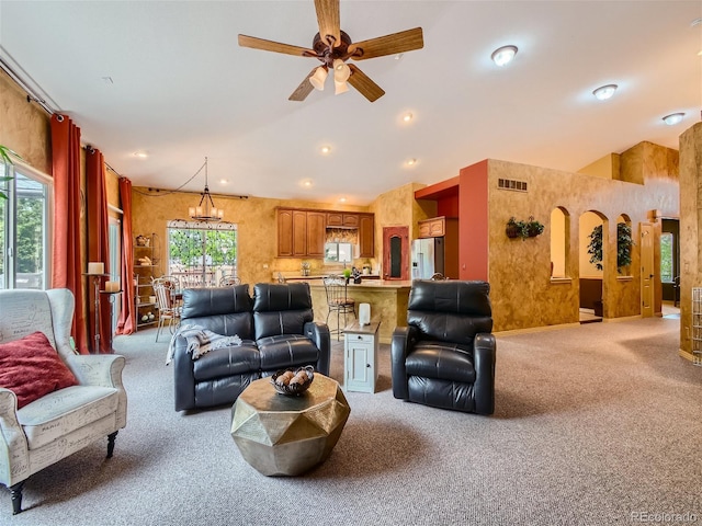 living room with carpet floors, plenty of natural light, and ceiling fan