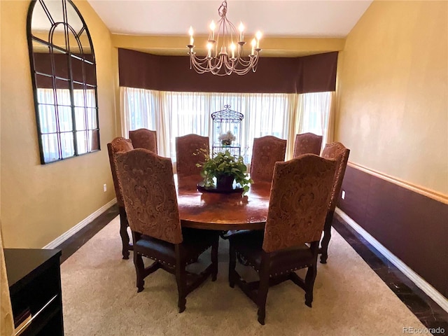 dining space with a chandelier