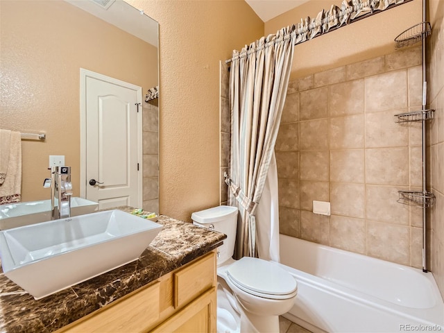 full bathroom featuring vanity, toilet, and shower / bath combo with shower curtain