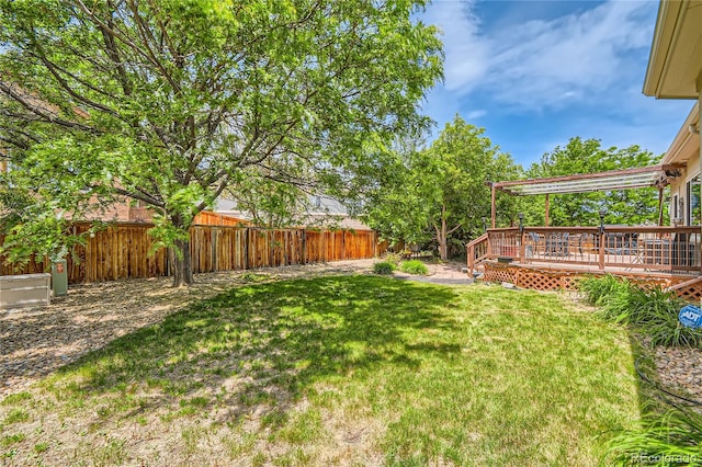 view of yard featuring a wooden deck