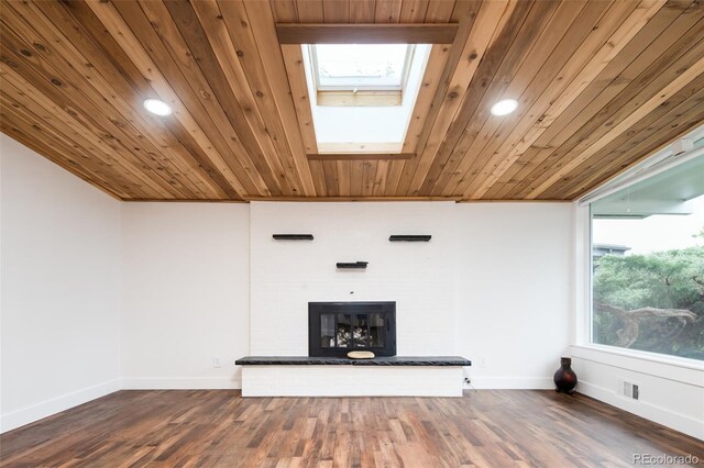 7695 Quitman St, Westminster, CO 80030 - unfurnished living room featuring a skylight, a fireplace, baseboards, wooden ceiling, and dark wood-style floors