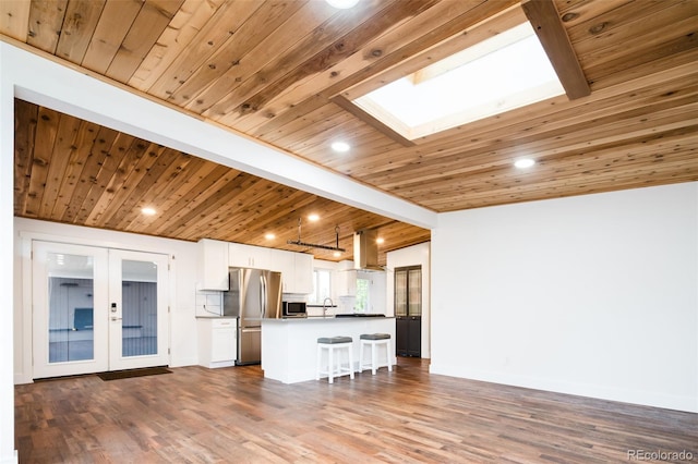 7695 Quitman St, Westminster, CO 80030 - living room with wooden ceiling, a skylight, wood finished floors, french doors, and recessed lighting
