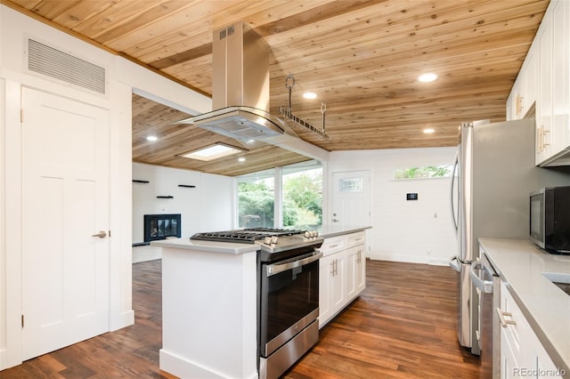 7695 Quitman St, Westminster, CO 80030 - kitchen with appliances with stainless steel finishes, wood ceiling, dark wood-style flooring, white cabinets, and a center island