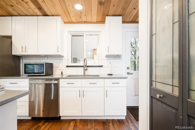 7695 Quitman St, Westminster, CO 80030 - kitchen with stainless steel appliances, wood ceiling, a sink, backsplash, and white cabinetry