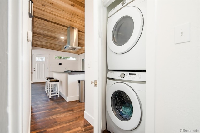 7695 Quitman St, Westminster, CO 80030 - washroom with stacked washer / dryer, wooden ceiling, dark wood finished floors, and baseboards