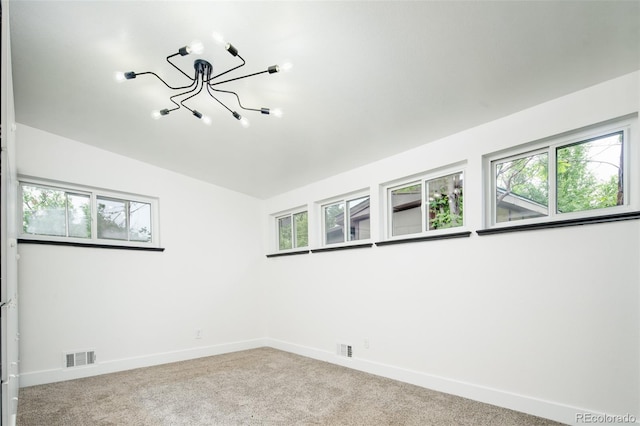 7695 Quitman St, Westminster, CO 80030 - carpeted spare room with a chandelier and baseboards