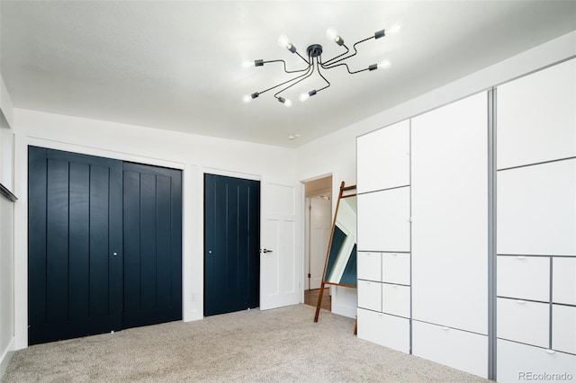 7695 Quitman St, Westminster, CO 80030 - unfurnished bedroom with carpet floors, two closets, and a chandelier