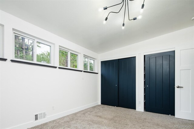 7695 Quitman St, Westminster, CO 80030 - unfurnished bedroom with carpet, baseboards, and multiple closets