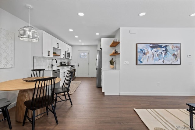 dining room with dark wood-type flooring and sink