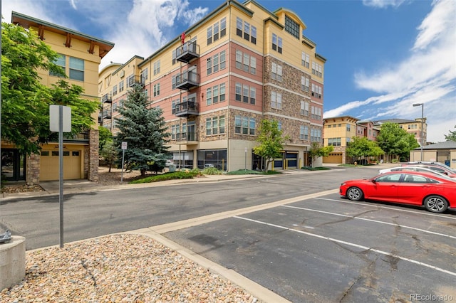 13456 Via Varra Unit 401, Broomfield, CO 80020 - view of apartment building / complex featuring uncovered parking