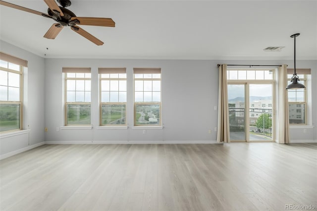 13456 Via Varra Unit 401, Broomfield, CO 80020 - unfurnished room with light wood-style floors and plenty of natural light