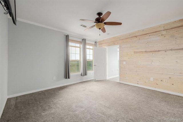 13456 Via Varra Unit 401, Broomfield, CO 80020 - empty room with wooden walls, a ceiling fan, carpet, and ornamental molding