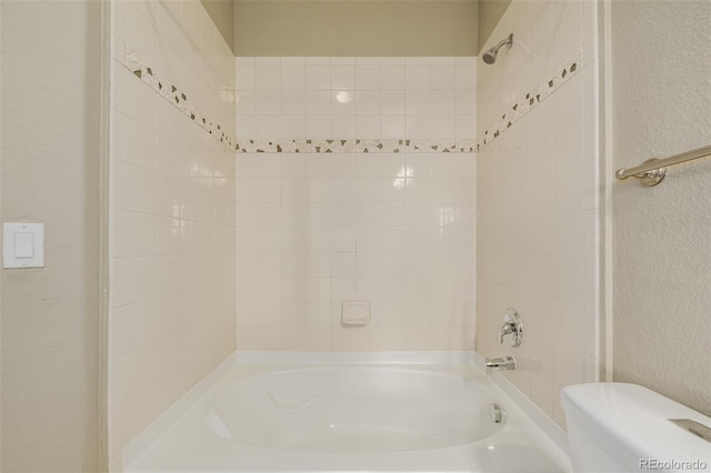 13456 Via Varra Unit 401, Broomfield, CO 80020 - bathroom with a textured wall and shower / bathtub combination