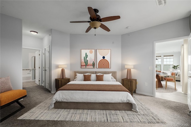 13456 Via Varra Unit 401, Broomfield, CO 80020 - bedroom with carpet, ensuite bath, and a ceiling fan