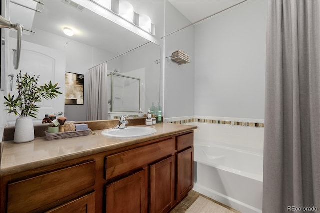13456 Via Varra Unit 401, Broomfield, CO 80020 - bathroom featuring a garden tub, vanity, curtained shower, and tile patterned flooring