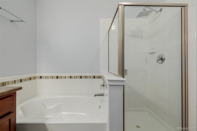 13456 Via Varra Unit 401, Broomfield, CO 80020 - full bath featuring a garden tub, a stall shower, and vanity