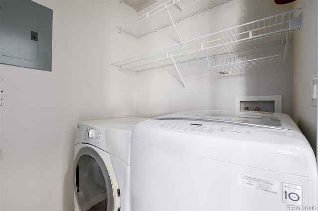 13456 Via Varra Unit 401, Broomfield, CO 80020 - washroom featuring electric panel and washing machine and dryer