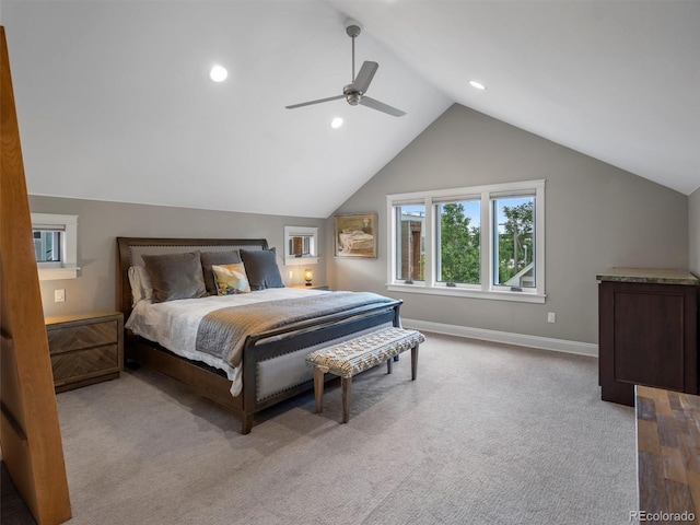 bedroom with ceiling fan, light carpet, and lofted ceiling