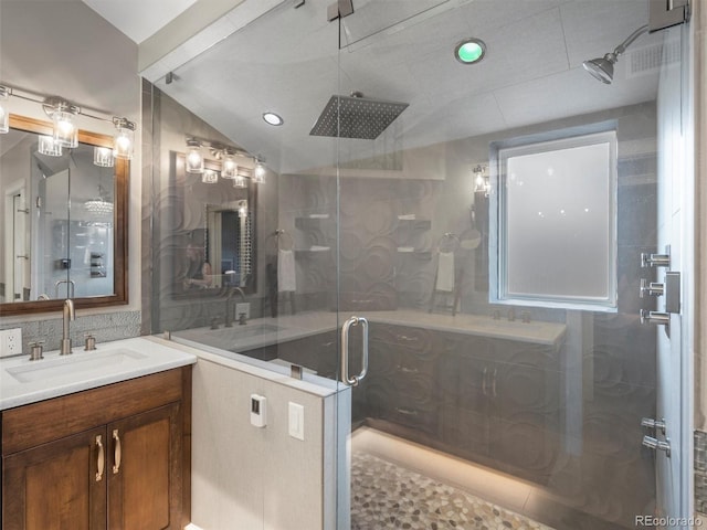 bathroom featuring vanity, tile patterned flooring, an enclosed shower, and lofted ceiling