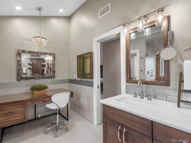 bathroom with vanity, tile patterned floors, and tile walls