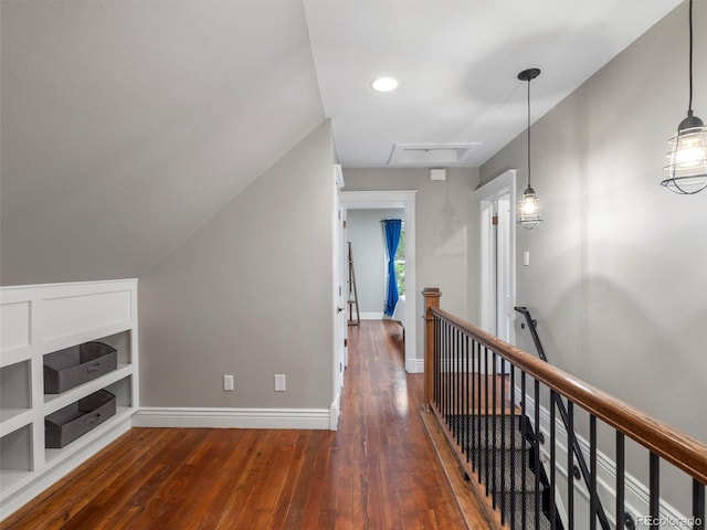 hallway featuring built in shelves and dark wood-type flooring