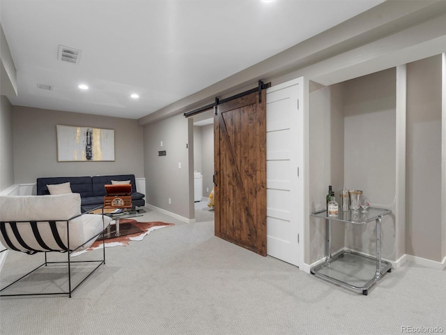 interior space featuring carpet floors and a barn door