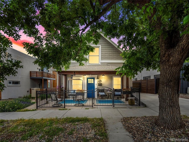 exterior space with a fenced in pool