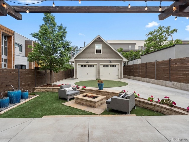 exterior space featuring an outdoor structure, a garage, and a fire pit