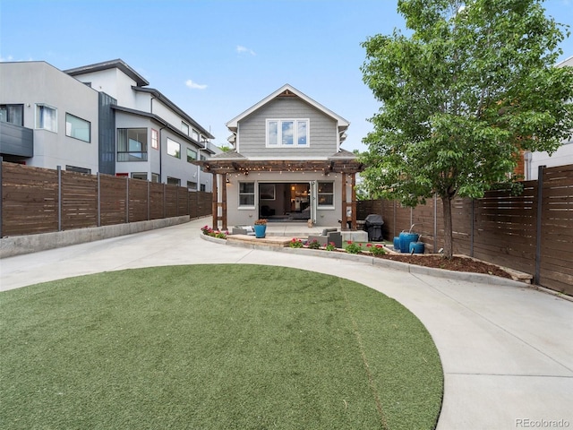 back of house featuring a yard