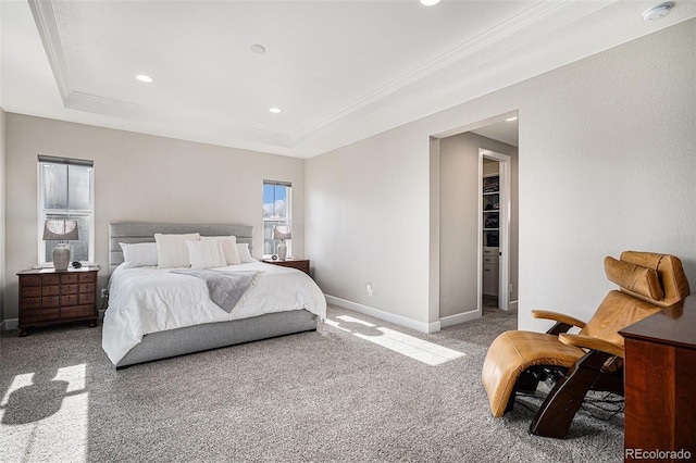 bedroom with light colored carpet, crown molding, and a tray ceiling