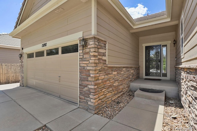 13787 Josephine Ct, Thornton, CO 80602 - property entrance featuring concrete driveway and stone siding