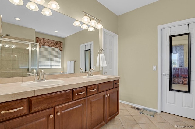 13787 Josephine Ct, Thornton, CO 80602 - bathroom featuring tile patterned flooring, a shower stall, and double vanity