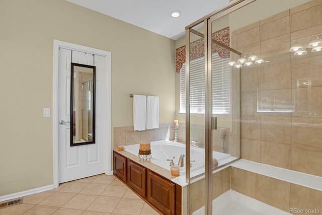 13787 Josephine Ct, Thornton, CO 80602 - full bathroom with a garden tub, tile patterned floors, and a shower stall
