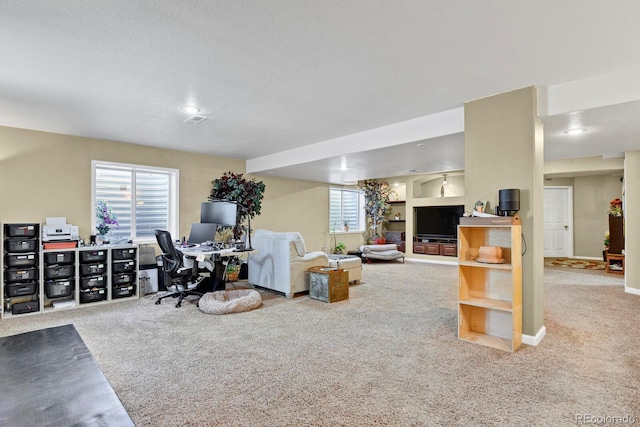 13787 Josephine Ct, Thornton, CO 80602 - living area featuring carpet floors, a desk, and a textured ceiling