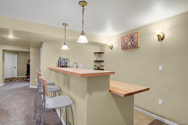 13787 Josephine Ct, Thornton, CO 80602 - bar area featuring pendant lighting and light colored carpet