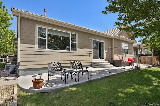 13787 Josephine Ct, Thornton, CO 80602 - rear view of property featuring entry steps, a patio, and an outdoor living space