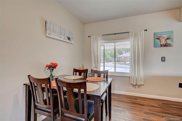 dining room with dark wood-type flooring