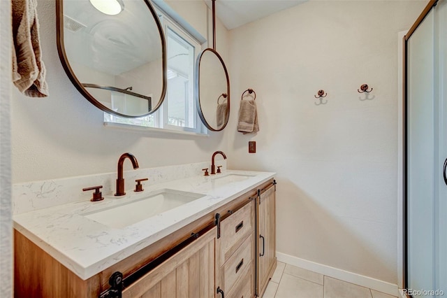 bathroom featuring tile patterned flooring and vanity