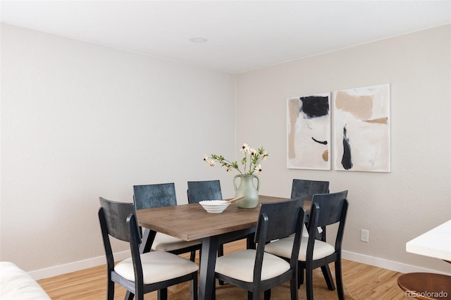 dining room with light hardwood / wood-style flooring