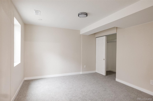 unfurnished bedroom with a closet and carpet