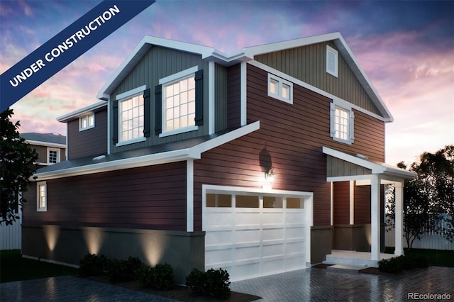 22392 E 38th Pl, Aurora, CO 80019 - view of front facade with an attached garage and decorative driveway