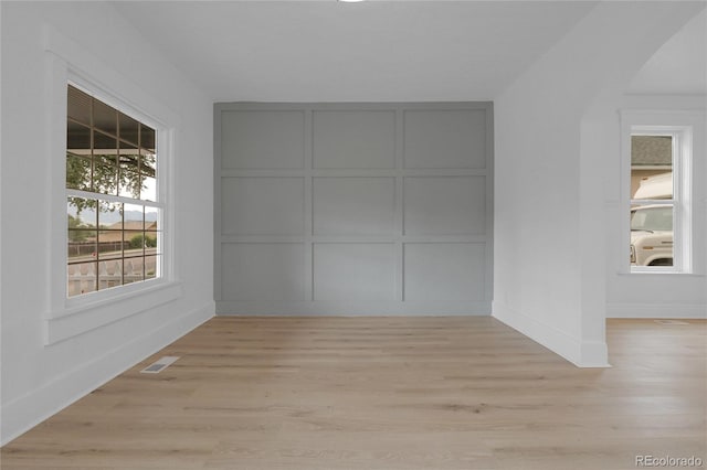 2803 N Cascade Ave, Colorado Springs, CO 80907 - unfurnished room featuring a decorative wall and light wood finished floors