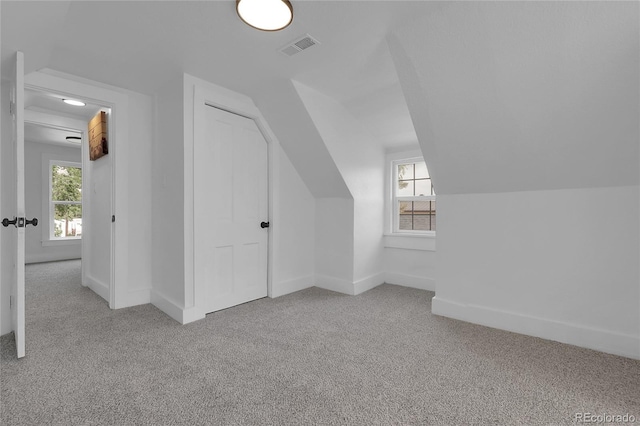2803 N Cascade Ave, Colorado Springs, CO 80907 - additional living space with carpet floors, lofted ceiling, and plenty of natural light