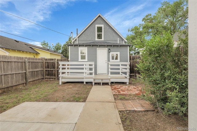 2803 N Cascade Ave, Colorado Springs, CO 80907 - back of property with a fenced backyard, a wooden deck, and a patio area
